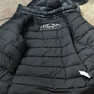 Black new coat. Keeps you very warm and good quality.